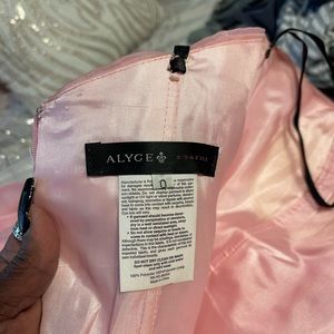 This is a pink prom dress only worn once and in great condition size zero.